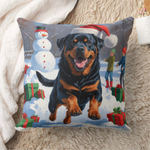 Rottweiler Running in Snow with Christmas Hat Cushion