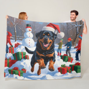 Rottweiler Running in Snow with Christmas Hat Fleece Blanket