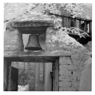 Rough adobe bell in entryway, Santa Fe, New Ceramic Tile