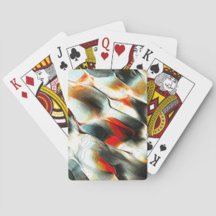 Rough silvery rock over burning ember, intensity playing cards