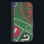 Roulette Table with Chips and Wheel Samsung S4 Wallet Case<br><div class="desc">The spinning wheel holds all the power on the roulette table, but the power of this painting is in the lifelike depiction of a casino scene. The green of the felt and the colour of the chips puts you at the table, waiting on your bet to pay off. Be sure...</div>