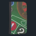 Roulette Table with Chips and Wheel Samsung S4 Wallet Case<br><div class="desc">The spinning wheel holds all the power on the roulette table, but the power of this painting is in the lifelike depiction of a casino scene. The green of the felt and the colour of the chips puts you at the table, waiting on your bet to pay off. Be sure...</div>