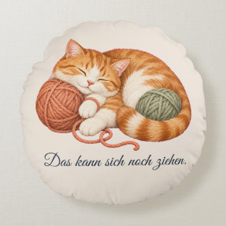 Round cat cushion with yarn and phrase,