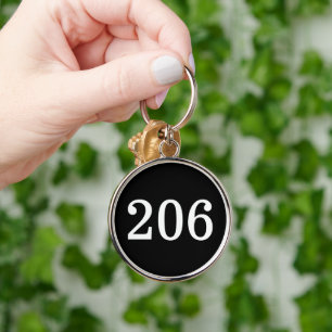 Round metal hotel room keychain with numbers