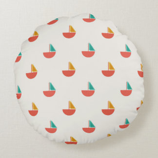 Round pillow with small sailboat pattern