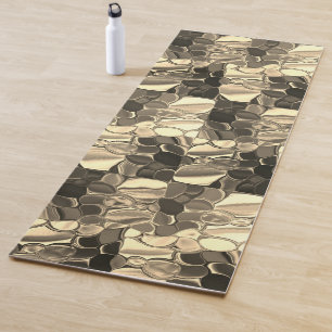 Rounded shapes in bronze colour, glossy light gold yoga mat