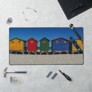 Row of Brightly Coloured Beach Huts Desk Mat