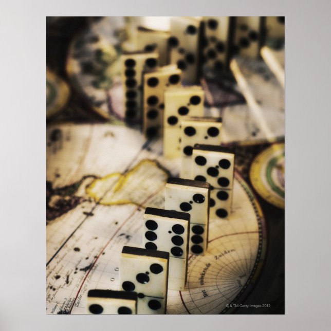 Row of dominoes on old world map poster (Front)