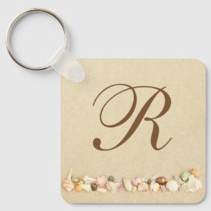 Row of Seashells on Beach Sand with Monogram Key Ring
