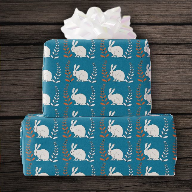Row of White Fluffy Bunnies Orange White Flowers Wrapping Paper (Sitting white bunny rabbits orange white plants on dark blue roll of gift wrapping paper.)