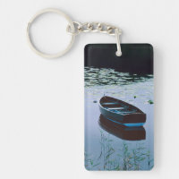 Rowboat on small lake surrounded by water