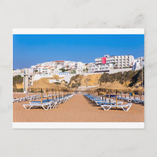 Rows of beach parasols with buildings.JPG Postcard