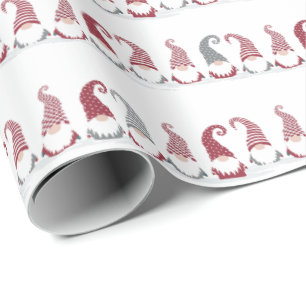 Rows of holiday gnomes in the snow wrapping paper