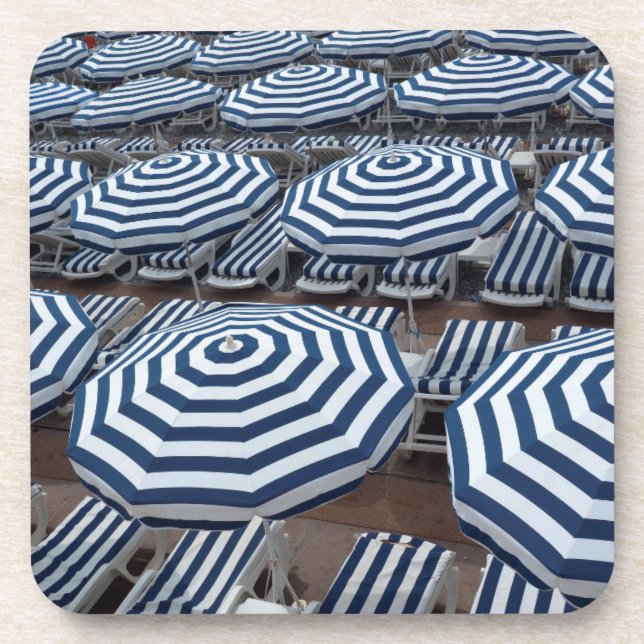 Rows Of Striped Beach Umbrellas With Sun Beds Coaster (Front)