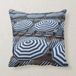 Rows Of Striped Beach Umbrellas With Sun Beds Cushion