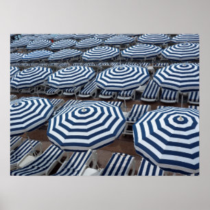 Rows Of Striped Beach Umbrellas With Sun Beds Poster
