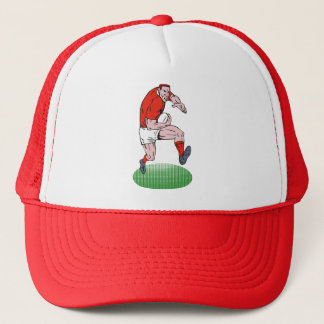 Rugby player running with ball trucker hat