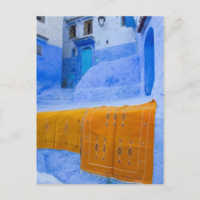 Rugs Draped On A Blue Wall Postcard (Front)