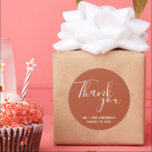 Rust Terracotta Boho Wedding Thank You Classic Round Sticker<br><div class="desc">Wedding favour stickers in a terracotta or rust colour with white text. Say thank you to your wedding guests with these personalised wedding stickers in a gorgeous script font that read: Thank you. Personalise with your names and wedding date.</div>