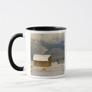 Rustic barn and hay bales after a fresh snow 2 mug