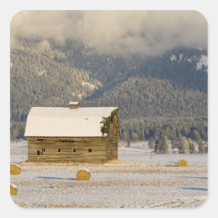 Rustic barn and hay bales after a fresh snow 2 square sticker