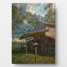 Rustic Barn Surrounded by fields under a Blue Sky.