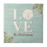 Rustic Beach Sand Dollar Ceramic Tile<br><div class="desc">A beach themed ceramic tile with the word love, and personalised with your name underneath. A sand dollar seashell creates the "o" in the word love. This coaster has a weathered textured wood background and the corners are decorated with sea grasses. This sand dollar ceramic tile is a great addition...</div>