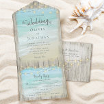 Rustic Beach String Lights Destination Wedding All In One Invitation<br><div class="desc">This all-in-one beach destination wedding invite includes the invitation and tearaway RSVP, and can be folded and mailed so you don’t need an envelope. Framed with a background of rustic weathered grey wood, beautiful aqua blue ocean waves crash against the beach and string lights decorate the top. Please see the...</div>