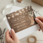Rustic Boots Floral String Lights Wedding Save The Date<br><div class="desc">Announce your upcoming events with a touch of country flair using our Rustic Boots Floral String Lights Wedding Save the Date Card. The pairing of rustic boots, delicate florals, and glowing string lights offers a blend of sophistication and down-to-earth charm. Ideal for couples envisioning a wedding in a barn, garden,...</div>