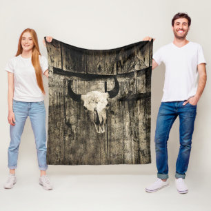 Rustic buffalo skull with horns on a barn fleece blanket