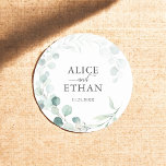 Rustic Eucalyptus Wedding Classic Round Sticker<br><div class="desc">Cherish the essence of your special day with our elegant Wedding Sticker, thoughtfully designed to add a touch of romance to your celebration. Encircling the circular sticker, a delicate watercolor wreath of eucalyptus symbolises enduring love and harmony. At its heart, your names are gracefully inscribed in a sophisticated serif font,...</div>