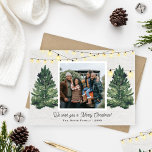 Rustic Family Photo Christmas Tree Farm Wood Holiday Card<br><div class="desc">Elegant "We wish you a Merry Christmas!" holiday photo card design features a rustic chic winter scene from a Christmas tree farm that frames a favourite family photo. Includes a white wood grain background with hanging string twinkle lights and fresh-cut green watercolor pine trees. Personalise with your choice of greeting,...</div>