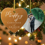 Rustic Gold Wedding Photo Keepsake Christmas Ceramic Ornament<br><div class="desc">These custom rustic gold wedding Christmas ornament feature elegant personalised white typography on an understated earth tone and your couple photo on the back. Simple light orange and brown hues follow the current fall trends for a bohemian wedding this autumn. Complete the look with your minimalist script on this keepsake...</div>
