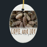 Rustic Holiday Love and Joy Pine Cone Ceramic Tree Decoration<br><div class="desc">Festive,  rustic pine cones accentuate this classic,  elegant design wishing holiday Love and Joy.</div>