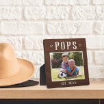 Rustic Personalised Pops Grandpa Photo Plaque<br><div class="desc">Custom grandpa plaque for Father's Day,  birthdays,  or Grandparents Day features a favourite photo of his grandchild or grandkids with "Pops" above in rustic lettering. Personalise with the year he became a grandfather beneath,  or add a custom message or name.</div>