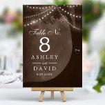 Rustic Tree String Lights Carved Initials Brown Table Number<br><div class="desc">Illuminate your rustic wedding reception with these charming table numbers. The warm brown background features a beautifully illustrated tree adorned with twinkling string lights. Carved initials add a personalised touch, making each table number a unique keepsake for your special day. Perfect for outdoor or indoor celebrations, these table numbers create...</div>