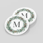 Rustic Winter Greenery Monogram Initial Wreath Round Paper Coaster<br><div class="desc">Elegant round white holiday drink coaster design features a rustic chic white wood grain background with a wreath of winter watercolor greenery framing a family / last name monogram initial. Includes a white background colour.</div>