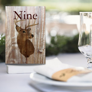 rustic wood grain deer the hunt is over wedding table number