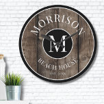 Rustic Wood Monogram Family Name Large Clock<br><div class="desc">This rustic clock is the perfect addition to your family beach house, lake house, game room, man cave, and more. It features a bold initial monogram at the centre, with your family name elegantly displayed at the top. The bottom reads "Beach House, " but this can be customised to fit...</div>