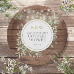 Rustic Wood Monogram Greenery Couples Shower Paper Plate<br><div class="desc">Featuring pretty string lights and delicate watercolor greenery leaves on a rustic wood background,  these chic botanical couples shower paper plates can be personalised with your monogram initials and special couples shower details. Designed by Thisisnotme</div>