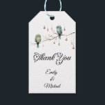 Rustic Woodland Love Birds  Romantic Wedding  Gift Tags<br><div class="desc">This charming image features two delicate birds perched on a bare branch, surrounded by hanging glass lights that look like vintage lanterns. The soft hues of green and blue in the birds' feathers and the minimalist background give the design a whimsical and rustic feel. The lights add a warm, magical...</div>