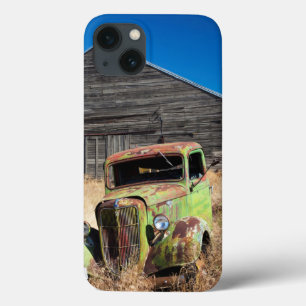 Rusting car in front of abandoned farm iPhone 13 case