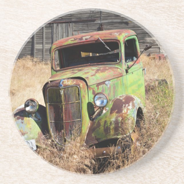 Rusting car in front of abandoned farm coaster (Front)