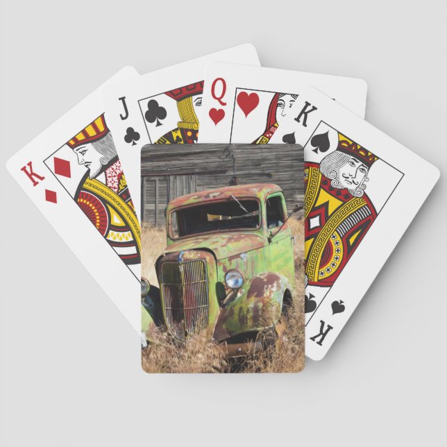 Rusting car in front of abandoned farm playing cards (Back)