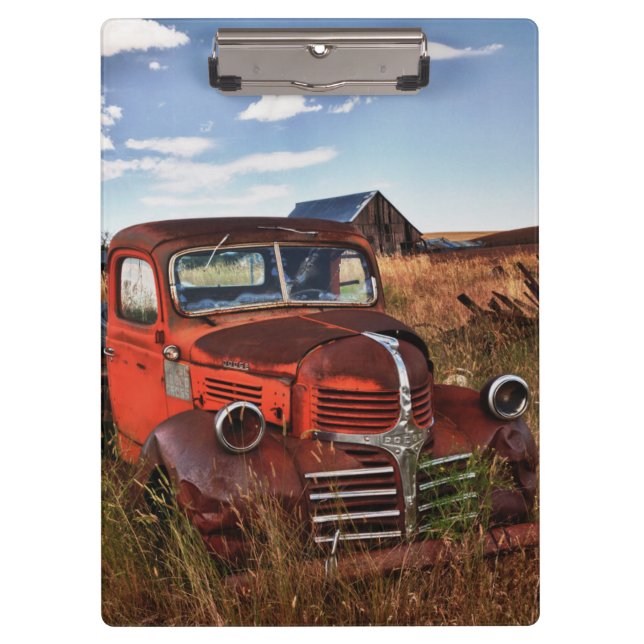Rusting orange Dodge truck with abandoned farm Clipboard (Front)