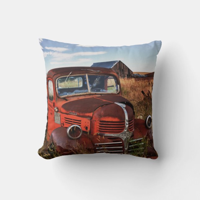 Rusting orange Dodge truck with abandoned farm Cushion (Front)