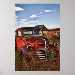 Rusting orange Dodge truck with abandoned farm Poster