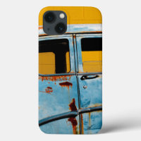 Rusty Blue Car and Yellow Wall