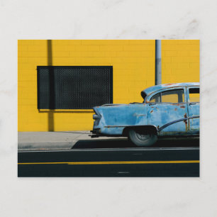 Rusty Blue Car and Yellow Wall Postcard