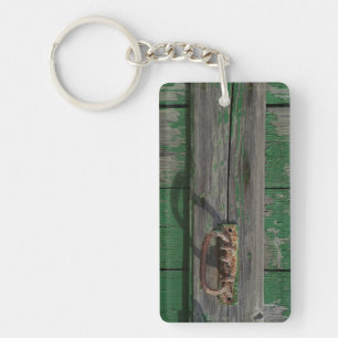 Rusty Door Handle On Green Door Key Ring